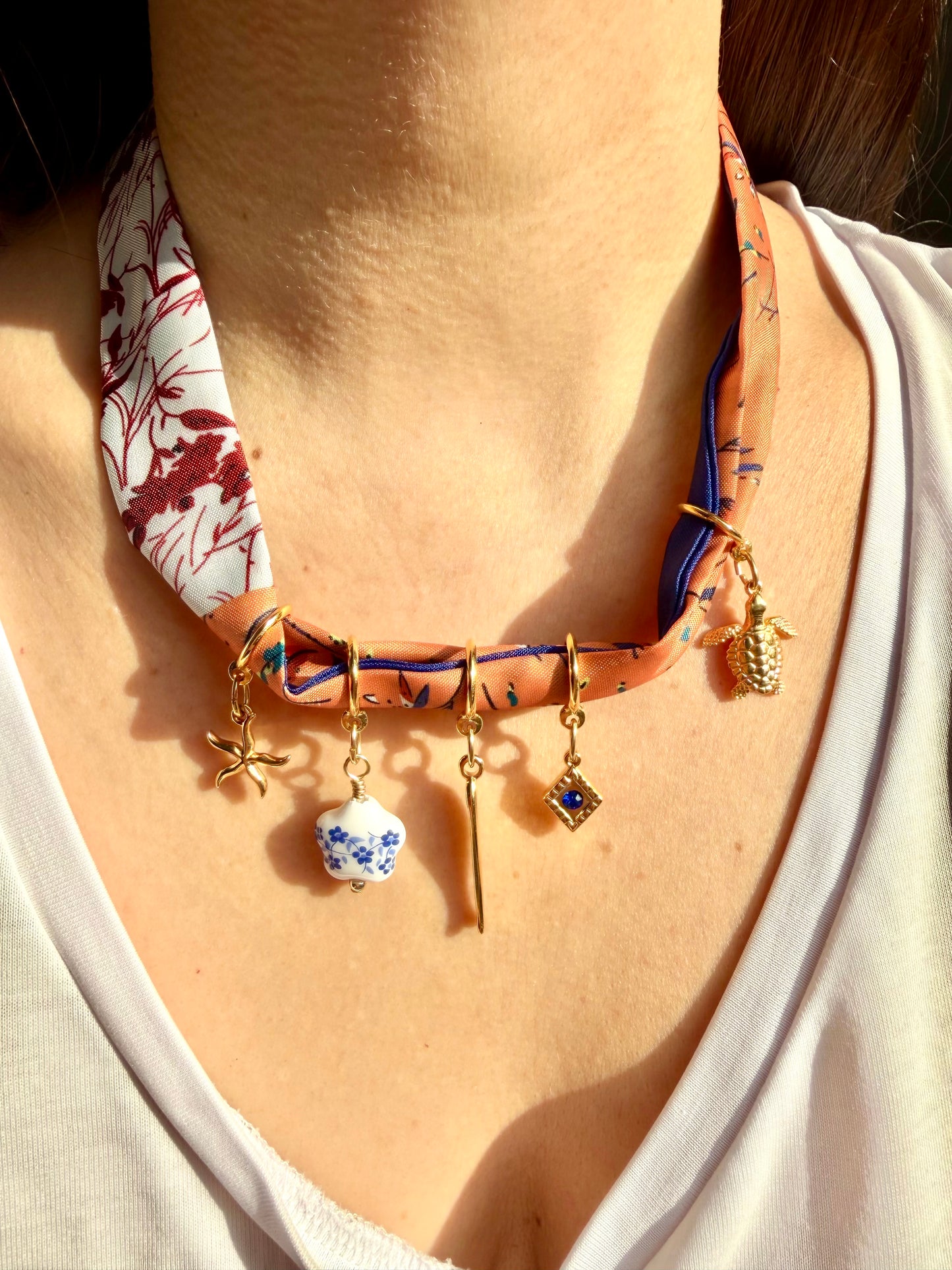 Charm bandana with orange and blue pendants • Gold charms &amp; silk scarf look