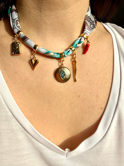 Charm bandana with gold pendants in a turquoise-brown mix • Eye-catching with symbols &amp; crystal detail